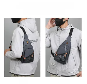 Detail showing grey men's chest bag worn as shoulder and crossbody bag