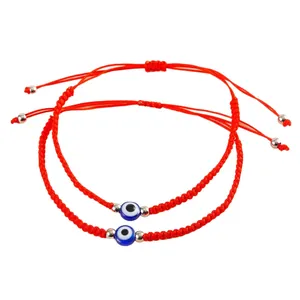 Set of 2 handmade adjustable red braided evil eye bracelets for protection and luck.