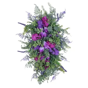 Spring summer wreath with purple tulips, lilacs, and hydrangeas for home wall decor