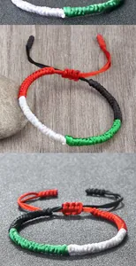 Macro detail showing the intricate knot pattern of the handmade flag rope bracelet.