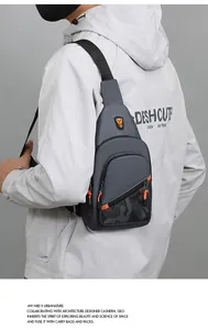 Urban style gray men's sling bag with vibrant orange zipper pulls and camouflage pattern
