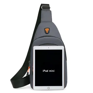 Stylish grey minimalist men's chest bag shown with iPad mini for size scale comparison