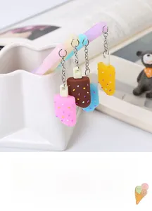 Macro view of colorful chocolate popsicle pendants attached to gel pens