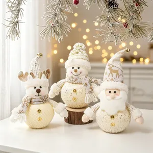 Set of three glowing plush Christmas figurines with reindeer snowman and Santa designs