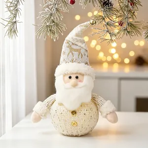 Detailed view of a glowing Christmas Santa plush doll with warm holiday lighting