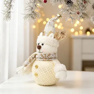 Detailed view of glowing Christmas reindeer snowman plush doll with gold bell hat