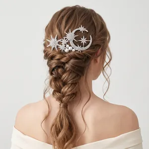 Silver star and moon bridal hair comb with rhinestones and pearls on braided hairstyle