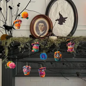 Mexican Day of the Dead sugar skull wooden ornaments hung on branches for festive home decor