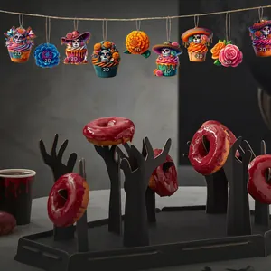 Wooden Day of the Dead ornaments featuring colorful skull cupcakes and vibrant flower designs.