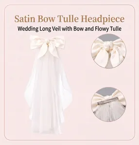 Detailed view of the double-layer bridal veil with a satin bow and secure metal clip.