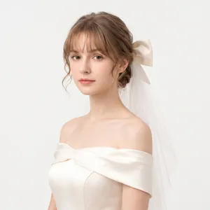 Elegant white double-layer bridal veil featuring a large satin bow and soft tulle