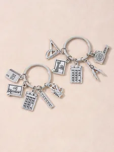 Close-up of silver metal school-themed charms keychain for teacher appreciation gifts