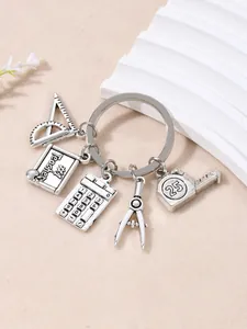 Silver metal teacher appreciation keychain with educational charms like calculator and ruler