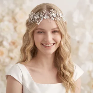 Close-up detail of a silver bridal headband with white pearls and crystals