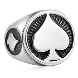 Close-up detail of a vintage stainless steel spade ring featuring a bold embossed pattern