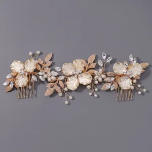 Elegant handmade bridal hair comb set with gold leaves, pearls and rhinestones.