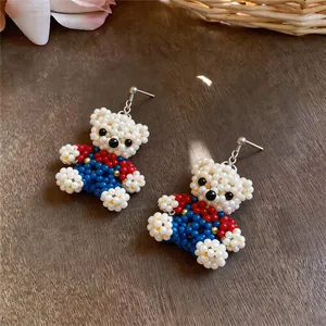 Handmade colorful beaded bear dangle earrings featuring a cute and whimsical design
