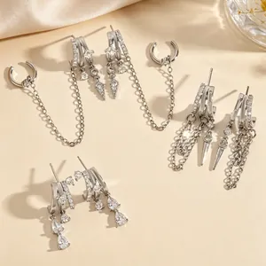 Detailed view of elegant silver-toned zirconia earrings featuring stylish tassel chains