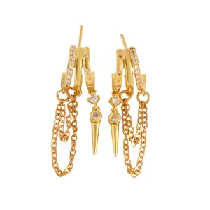 Detail shot of gold-plated triple hoop earrings with CZ tassels and spike