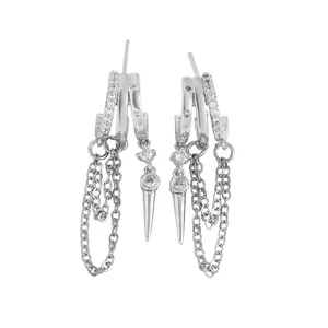Detailed view of silver-toned fringe hoop earrings with cubic zirconia and spike charms.