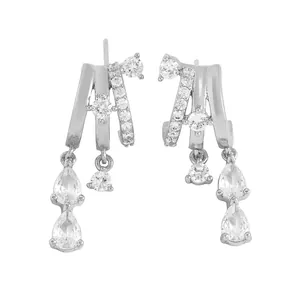 Detailed macro view of silver hoop earrings featuring cascading cubic zirconia pear drops