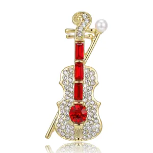 Elegante spilla a violino dorata con pietre rosse e cristalli scintillanti da donna