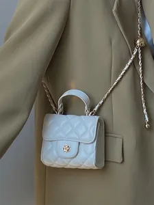 Elegant white quilted mini crossbody bag with gold camellia clasp and chain strap