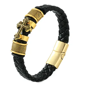 Men's vintage black braided leather bracelet featuring an ornate gold cross and magnetic clasp