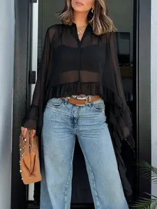 Detailed view of sheer black ruffled cape blouse with elegant tiered chiffon sleeve design