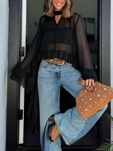 Detailed view of a sexy black sheer blouse with ruffles and a stylish choker neck.