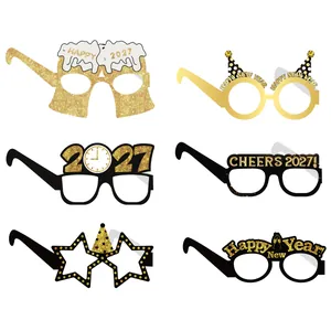Detail of six festive 2027 New Year party paper glasses with gold glitter designs