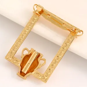 Detailed back view of an artistic gold-tone rectangular vase-themed brooch for suits