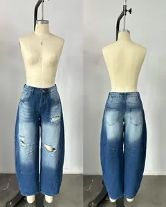 Front and back view of distressed loose fit vintage denim jeans for women