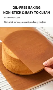 Detail of a reusable non-stick baking oil cloth being lifted from a freshly baked cake