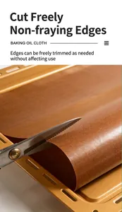 Detailed macro view of heat-resistant non-stick baking cloth being cut to size with scissors