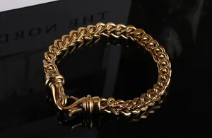 Detailed close-up of a gold-plated titanium steel Franco chain bracelet for men with clasp
