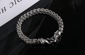 Detailed view of silver-tone titanium steel curb chain bracelet for men with unique clasp