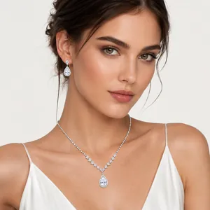Elegant vintage bridal jewelry set with pear-shaped crystal necklace and earrings