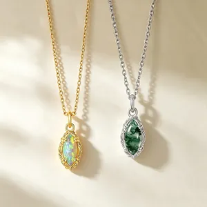 Close-up of gold and silver S925 sterling silver necklaces with marquise opal pendants.