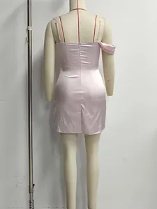 Back view of sexy pink satin camisole dress with zipper detail displayed on mannequin
