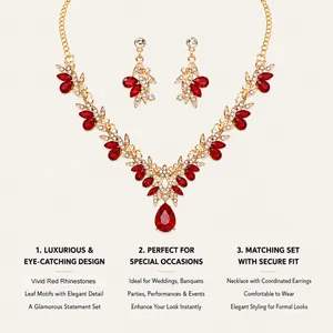 Luxury bridal jewelry set featuring vivid red teardrop rhinestones and gold leaf motifs.