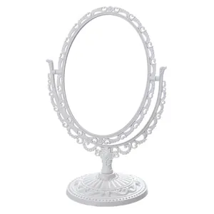 Vintage European style white oval desktop makeup mirror with intricate filigree