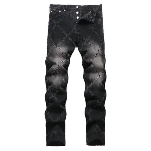 Men's black slim-fit denim jeans featuring a heavy beaded cross pattern and stylish faded wash