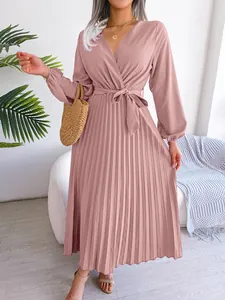 Detail view of an elegant mauve pleated maxi dress featuring a V-neck and waist tie design.