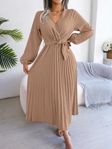 Elegant crossover V-neck pleated maxi dress with long sleeves and waist tie in camel brown