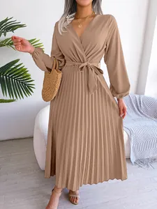 Elegant beige V-neck long sleeve pleated maxi dress with waist tie and fluid skirt