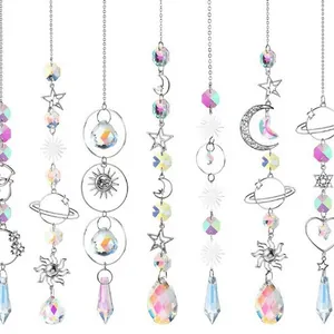 Silver celestial crystal suncatchers with sun, moon, and star charms for garden decor.