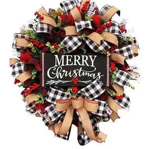 Festive Christmas wreath featuring red berries, plaid ribbons, and a Merry Christmas sign