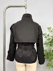 Back view of a premium black short trench coat featuring a belted waist and storm flap