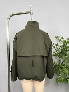 Back view detail of an olive green double-breasted short trench coat for women